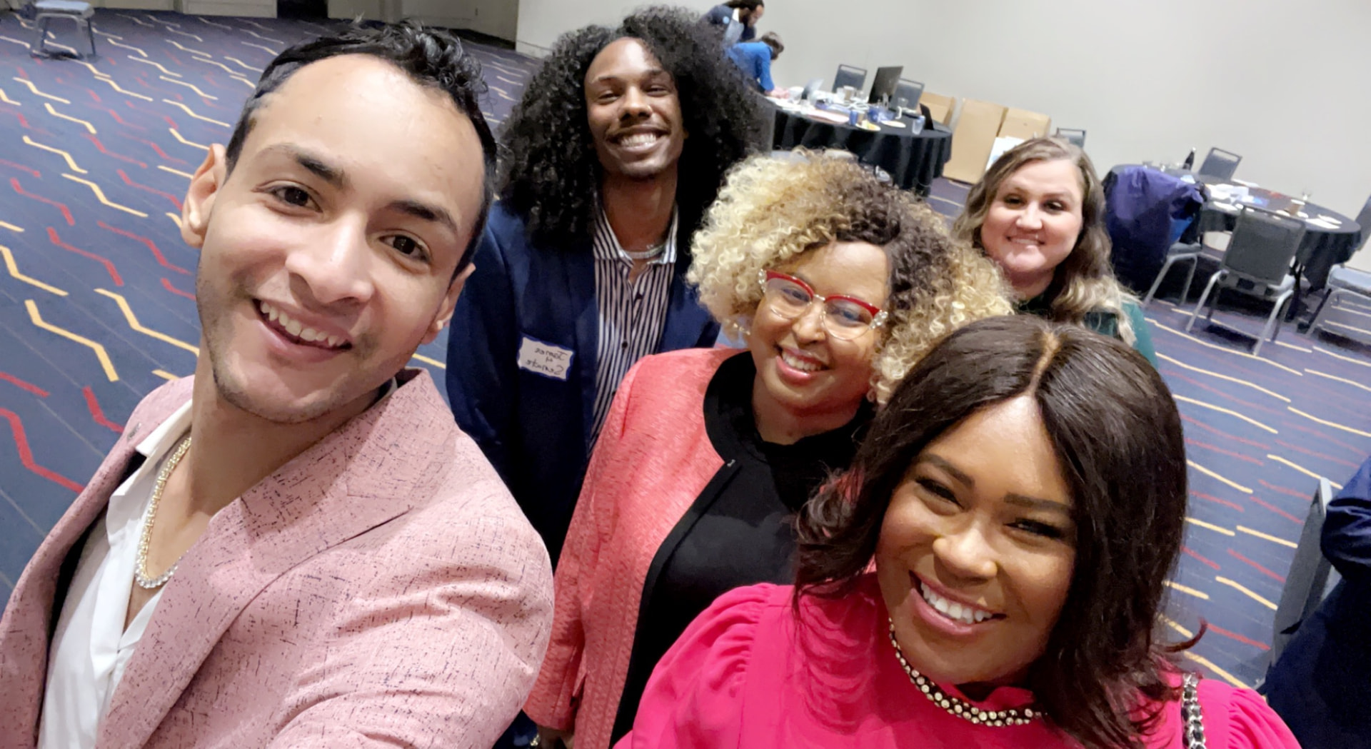 Natalie James with a diverse group of organizers at a convention