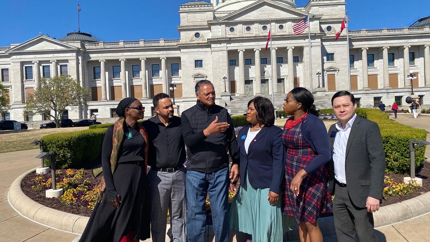 Natalie James standing with Rev. Jesse Jackson and other civic and civil rights leaders in front of the Arkansas State Capitol