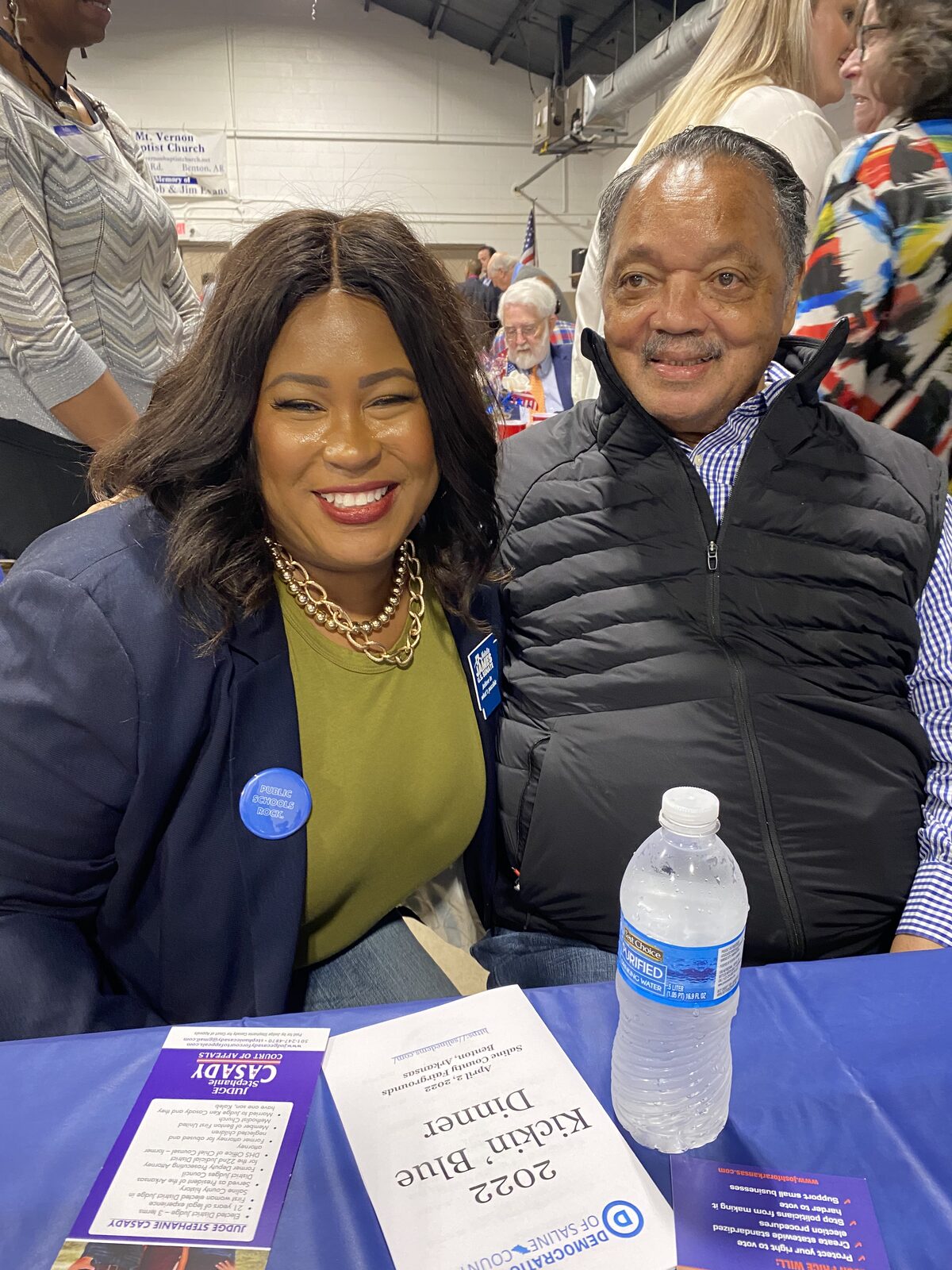 Natalie James at a county Democratic Party dinner in Arkansas wearing a Public Schools Rock button